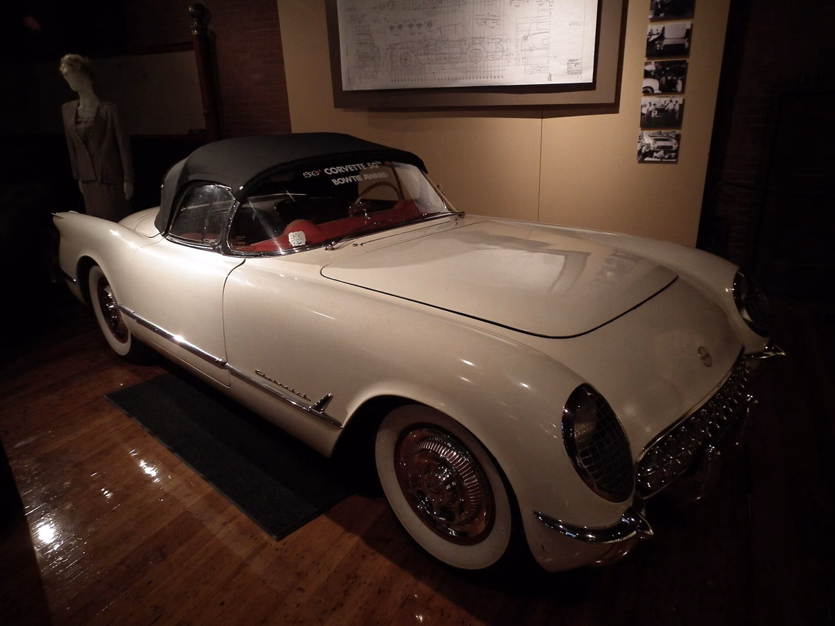 A white 1953 Chevrolet Corvette with a black top on display at the Larz Anderson Auto Museum
