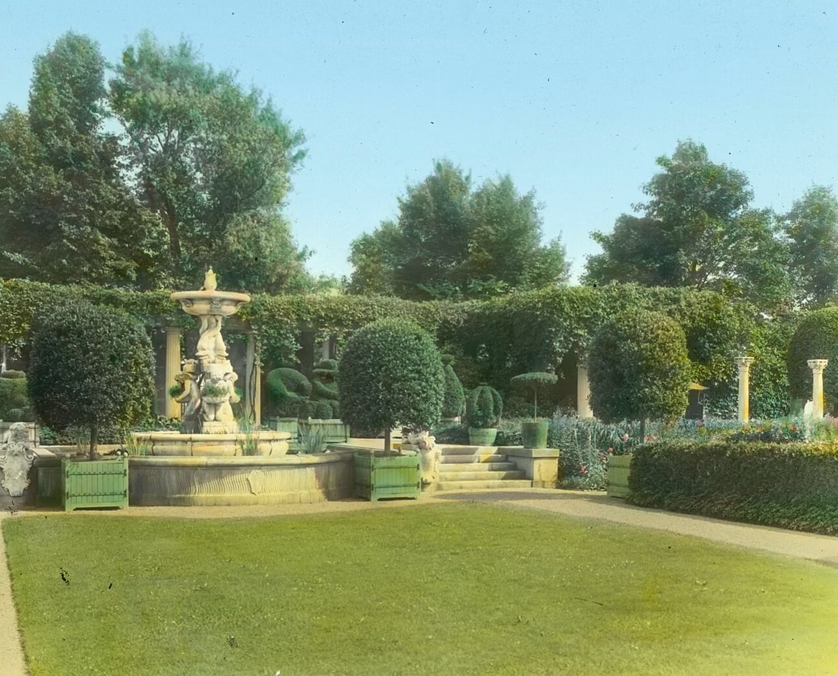 The Andersons' Italian Garden seen from the terrace toward the cupid fountain, in a hand-colored 1914 lantern slide